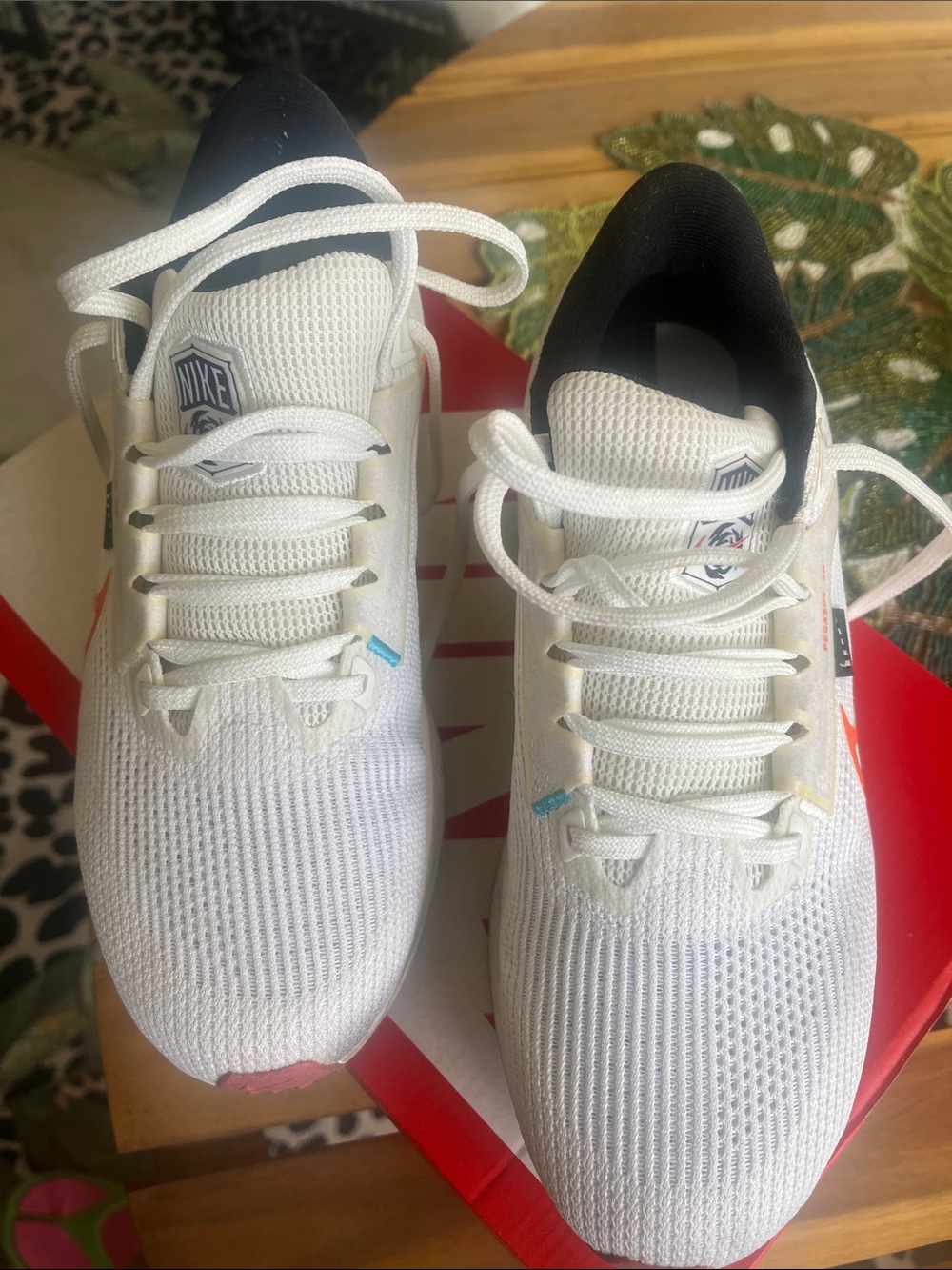 Nike women’s White and Black Mesh Sneakers with Pink Accent